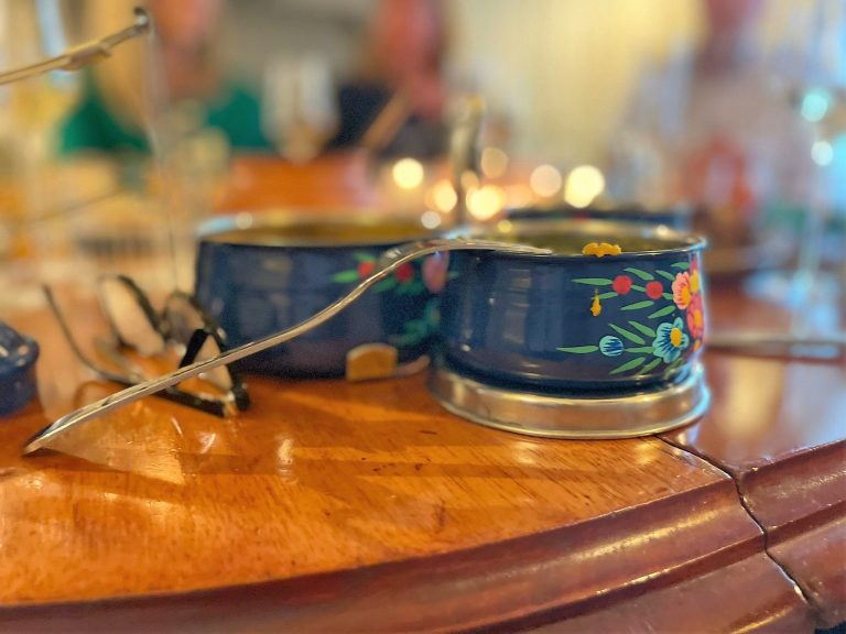 Indian popup with tiffin and glasses, fork leaning